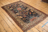 Antique Kurdish Bijar rug corner, showcasing oversized floral motifs, nuanced pattern, and intricate borders with even wear.