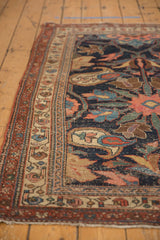 Kurdish Bijar rug side border showing blush, mallard green, and navy motifs with even wear.