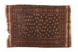 Antique hand-knotted Belouch rug with terracotta and blue boteh pattern on a dark field.