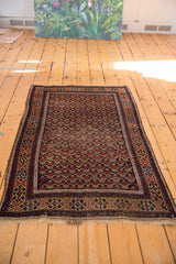 Antique Persian Belouch rug, allover trellis floral design with mostly even wear showing foundation.