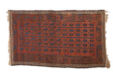 Antique Belouch rug, madder red geometric floral columns with blue accents, late 19th century.