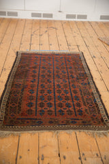 Original intact side cord selvage and fringe, deep madder red field, antique Belouch rug.