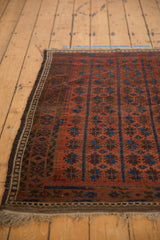 Fringe and geometric border detailing madder root red and blue motifs on late 19th century Belouch rug.