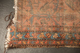 Tattered end of antique Lilihan runner, sky blue serrated leaf border, and visible foundation wear.