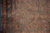 Antique Lilihan rug border, sky blue serrated leaves, blush florals, and evenly worn pile.