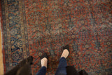 Vintage Mahal rug's red and navy allover henna design with visible wear to knot heads.