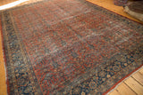 Vintage Mahal carpet with madder root red henna design, navy blue border, and visible wear across knot heads.