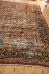 Vintage Mahal carpet corner with samovar main border, chestnut rust, navy blue, and fringe.
