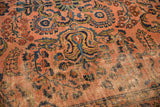 Antique Persian Lilihan carpet, dusty rose field with floral sprays and visible foundation.