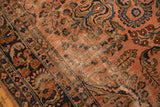 Visible wear and exposed foundation on the antique Lilihan's dusty rose floral field.