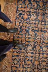 Vintage Hamadan runner's navy blue and copper Herati motif with visible pile wear.