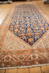 Corner spandrel with unusual starbursts and Herati motif in navy, copper, ivory, showing mostly even wear.