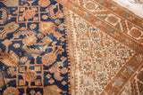 Navy blue Herati motif contrasting with ivory starburst spandrel, showing mostly even wear.