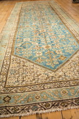 Distressed low pile on aqua field with Herati motif and intricate ivory border pattern.