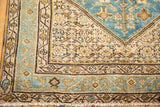 Distressed vintage Hamadan corner with aqua blue Herati motif and low pile.