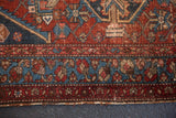Antique Hamadan rug's lower border, with red, navy blue geometric motifs and light tatter.