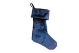 Lustrous cobalt navy velvet stocking with a folded cuff and hanging loop.