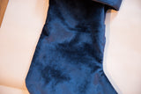 Cobalt navy velvet stocking with a soft, rich texture.