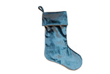 Silvery teal velvet stocking with a folded cuff and hanging loop.