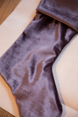 Luxurious texture and soft sheen of the light plum velvet stocking.
