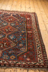 Vintage Afshar rug geometric border, sapphire blue field, and stylized animal motifs.