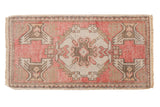 Distressed Vintage Oushak rug, raspberry, ivory, and coffee medallion, flanking motifs, 1'7