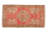 Vintage Distressed Oushak rug mat with blush pink field, oversized medallion, and foundation showing 1'7