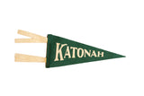 Katonah mini forest green wool felt pennant with cream text and ties, 4x9 inches.
