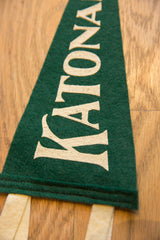 Textured forest green felt pennant with cream ONAH lettering and contrasting ties.