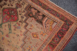 Vintage Farahan Sarouk rug corner, delicate floral vines, cherry red, antique ivory, and charcoal borders.