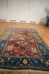 Vintage Bijar rug: brick red Harshang flower field, navy blue samovar turtle border.
