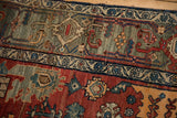 Detail of vintage Persian Bijar rug with cherry red, oxidized silver patterns, and dramatic abrashes.