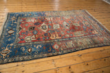 Vintage hand-knotted Bijar rug corner with navy samovar turtle border and cherry red Harshang field.