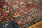 Vintage Bijar rug detail: samovar turtle border, red Harshang field, and dramatic abrashes.