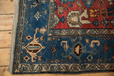 Vintage Bijar rug corner detail: navy samovar turtle border, cherry red Harshang motif.