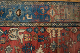 Vintage Bijar rug border with samovar turtle motif and vibrant red field abrashes.