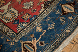 Vintage Bijar rug detail with red Harshang field and navy samovar turtle border.