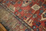 Vintage Bijar rug's brick red field with abrashes and a gray-green samovar border.
