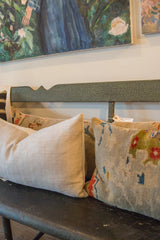 Subtle textured linen fabric detail showcasing the light neutral color of the lumbar pillow.