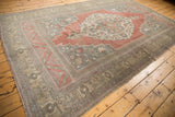 Distressed vintage Oushak rug corner, faded raspberry, oxidized silver, and pale bronze floral borders.