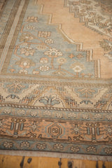 Distressed Oushak rug border, low pile, geometric floral patterns, apricot and slate blue.