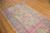 Distressed mauvy-pink Oushak runner with geometric stepped medallion and serrated leaf border.