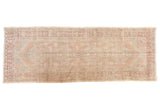Distressed vintage Oushak runner with Rococo medallion, ivory, peach, pink, mostly even wear, 3'5