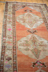 Vintage Distressed Oushak runner, abrashed terra cotta field, sharp contour medallion, detailed border.