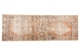 Vintage Distressed Oushak runner with serrated medallions, worn ivory and terra cotta.