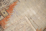 Distressed Oushak rug pile texture, fringe, and woven foundation.