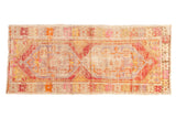 Distressed vintage Oushak runner with double diamond medallions and playful faded florals, 2'8