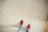 Distressed Oushak carpet showing subtle tone-on-tone pattern and light textured pile.