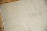 Vintage distressed Oushak carpet displaying subtle tone-on-tone patterns and wear to knot heads.