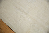 Textural pile of the vintage distressed Oushak rug with subtle Rococo inspired pattern.